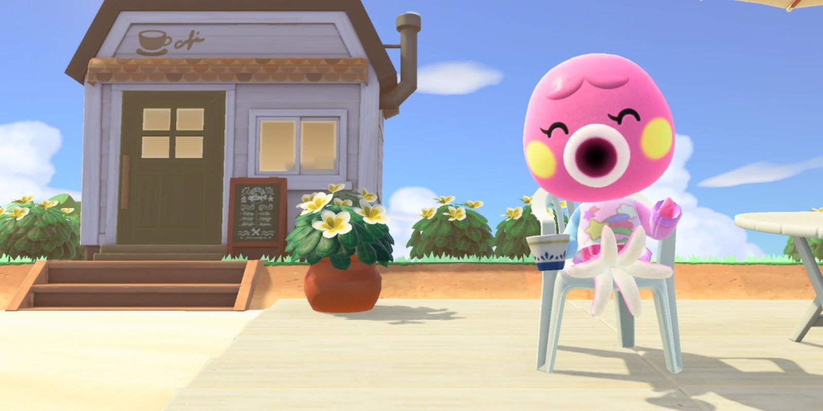 Marina drinks tea while sitting in a chair on the beach.