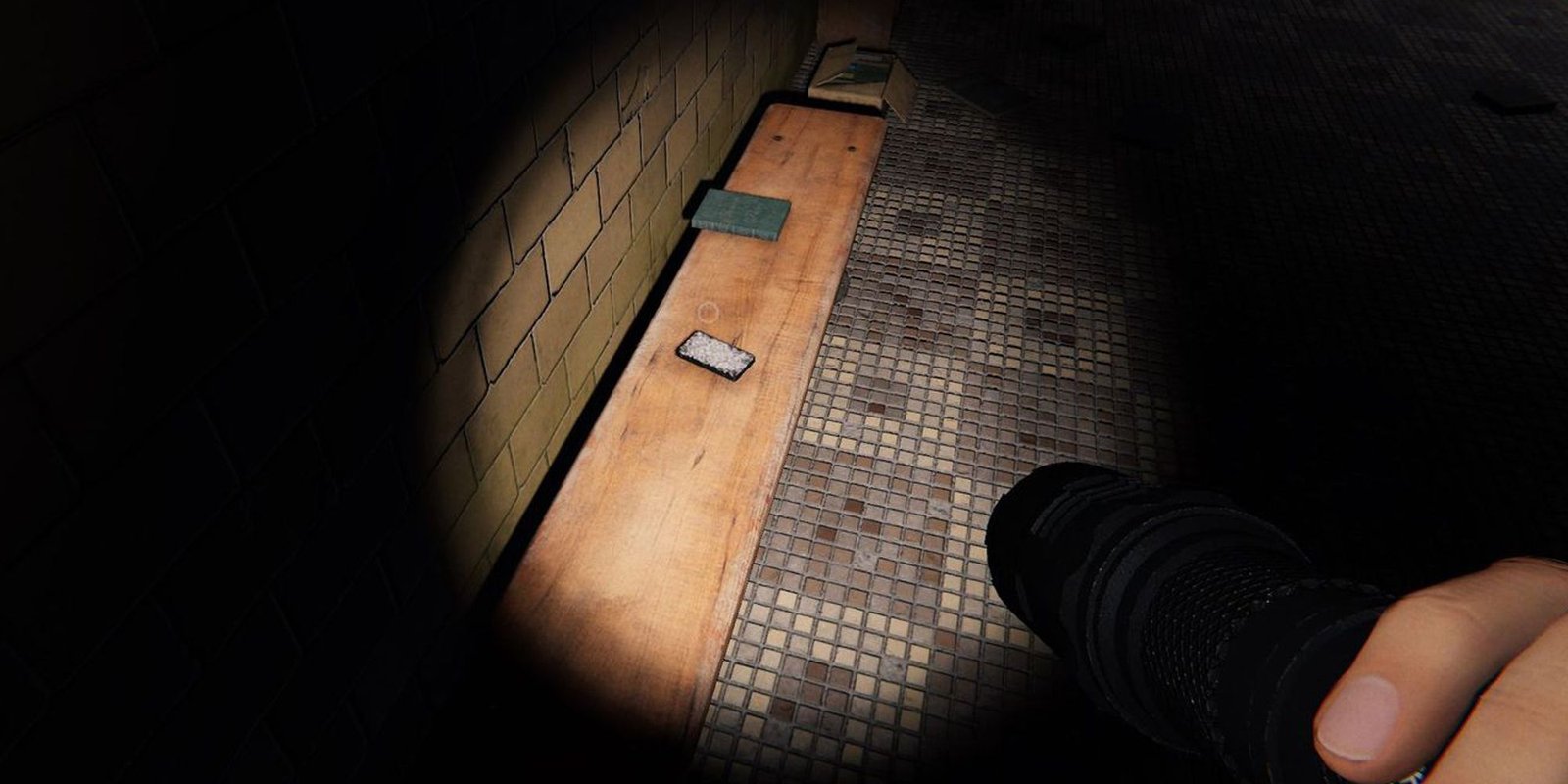 Image depicts a character in Phasmophobia pointing a flashlight on a pack of tarot cards on a wooden bench.