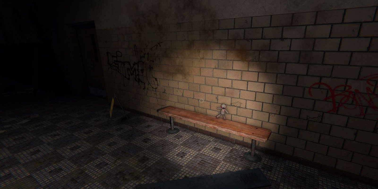 Image depicts a small voodoo doll on a wooden bench in Brownstone High School in Phasmophobia. 