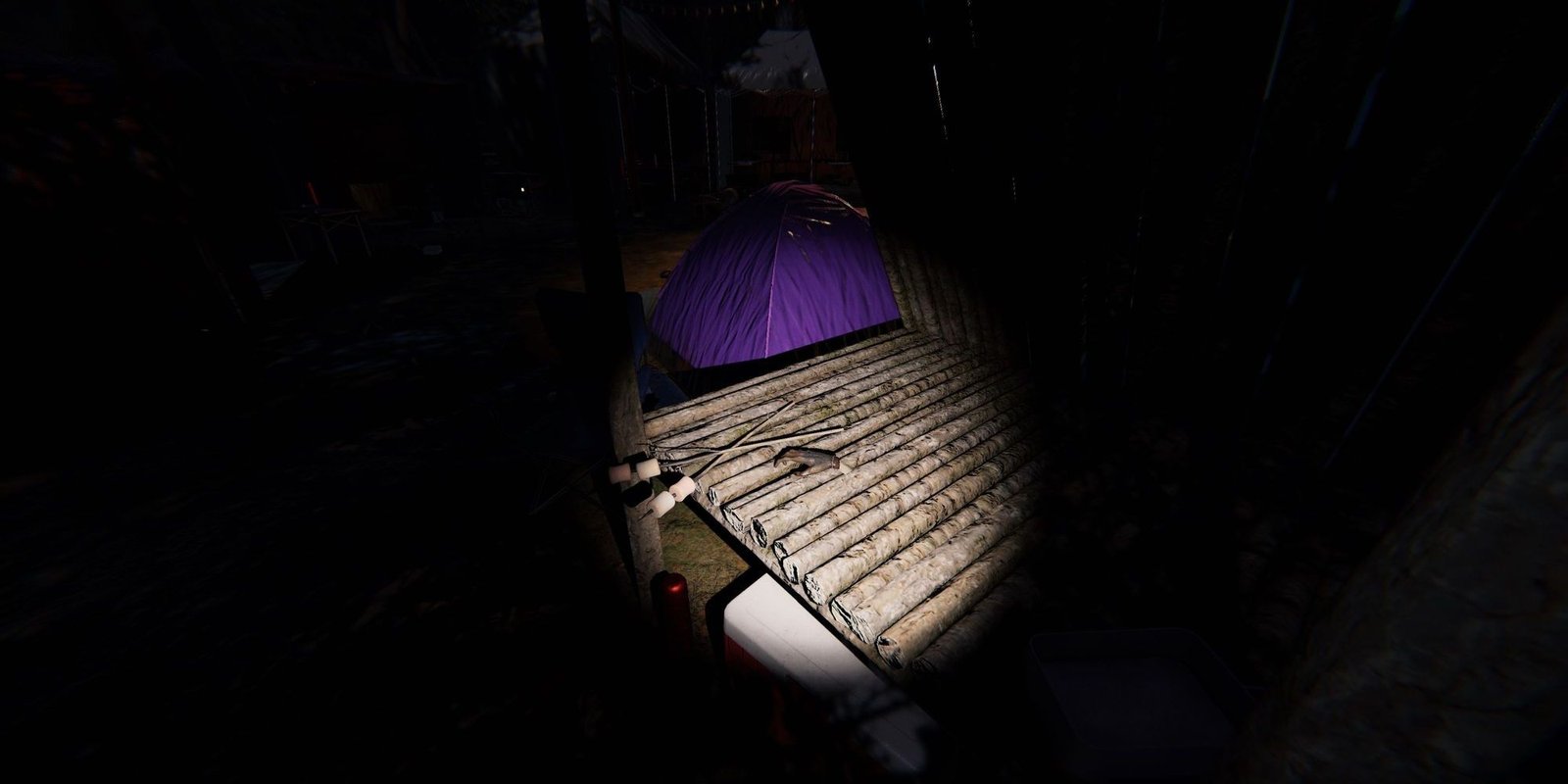 Image depicts a monkey paw on a wooden platform in Camp Woodwind in Phasmophobia.