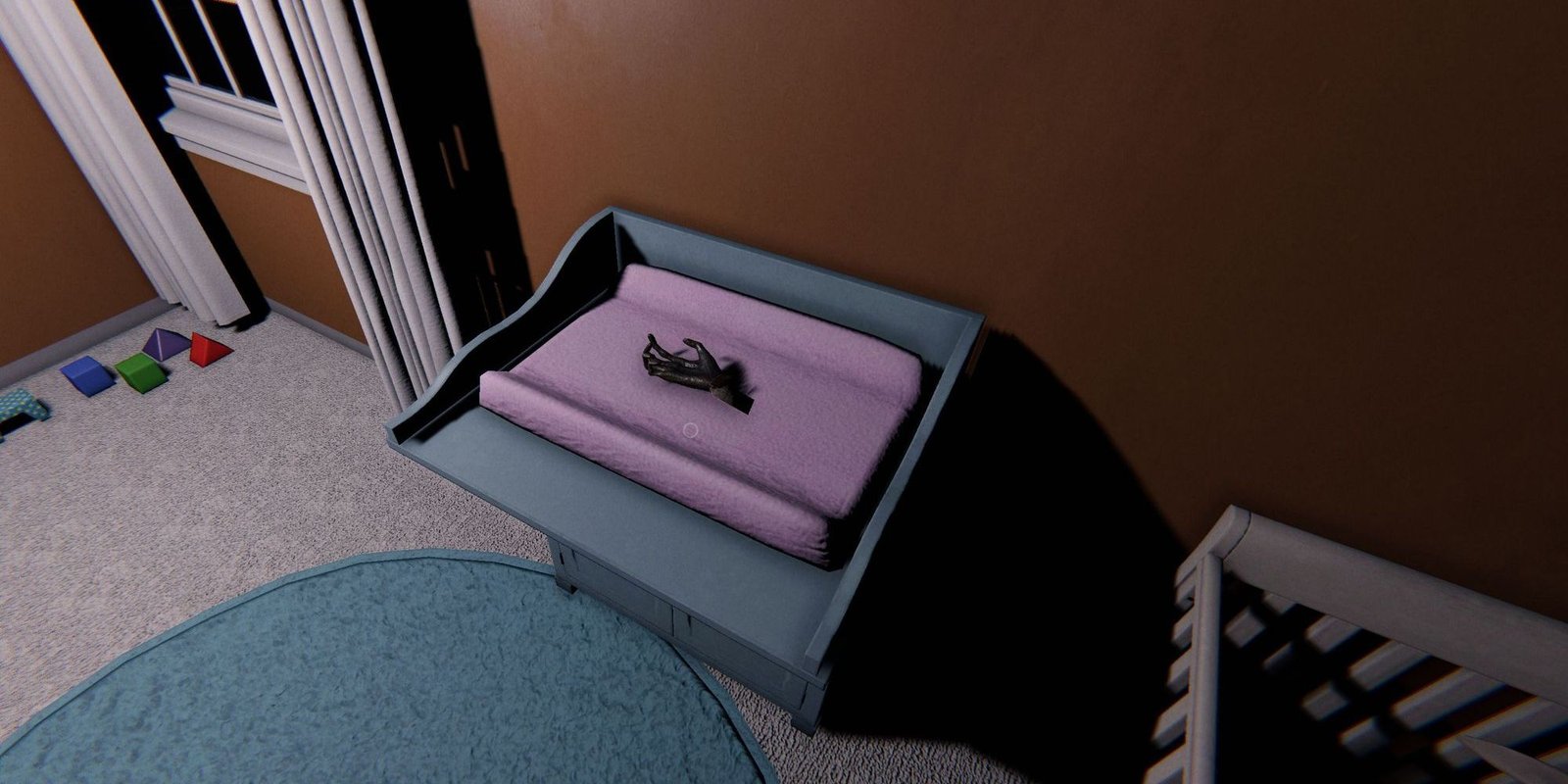 Image depicts a monkey paw on a blue and pink changing table in Edgefield Road in Phasmophobia.