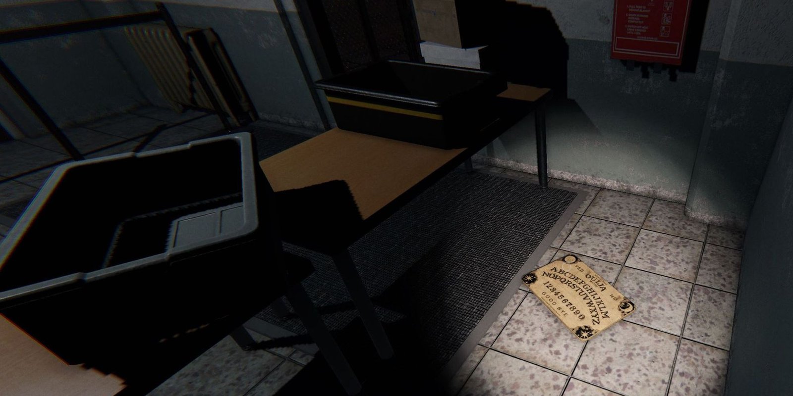 Image depicts a Ouija Board on the floor of a security room in the Prison in Phasmophobia.