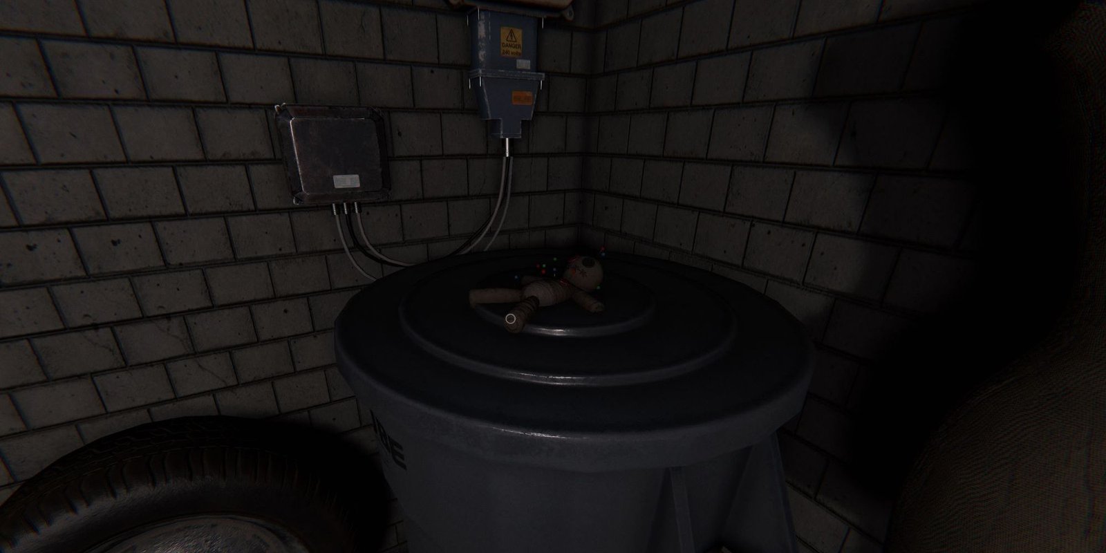 Image depicts a voodoo doll on a plastic container in Tanglewood Drive in Phasmophobia.
