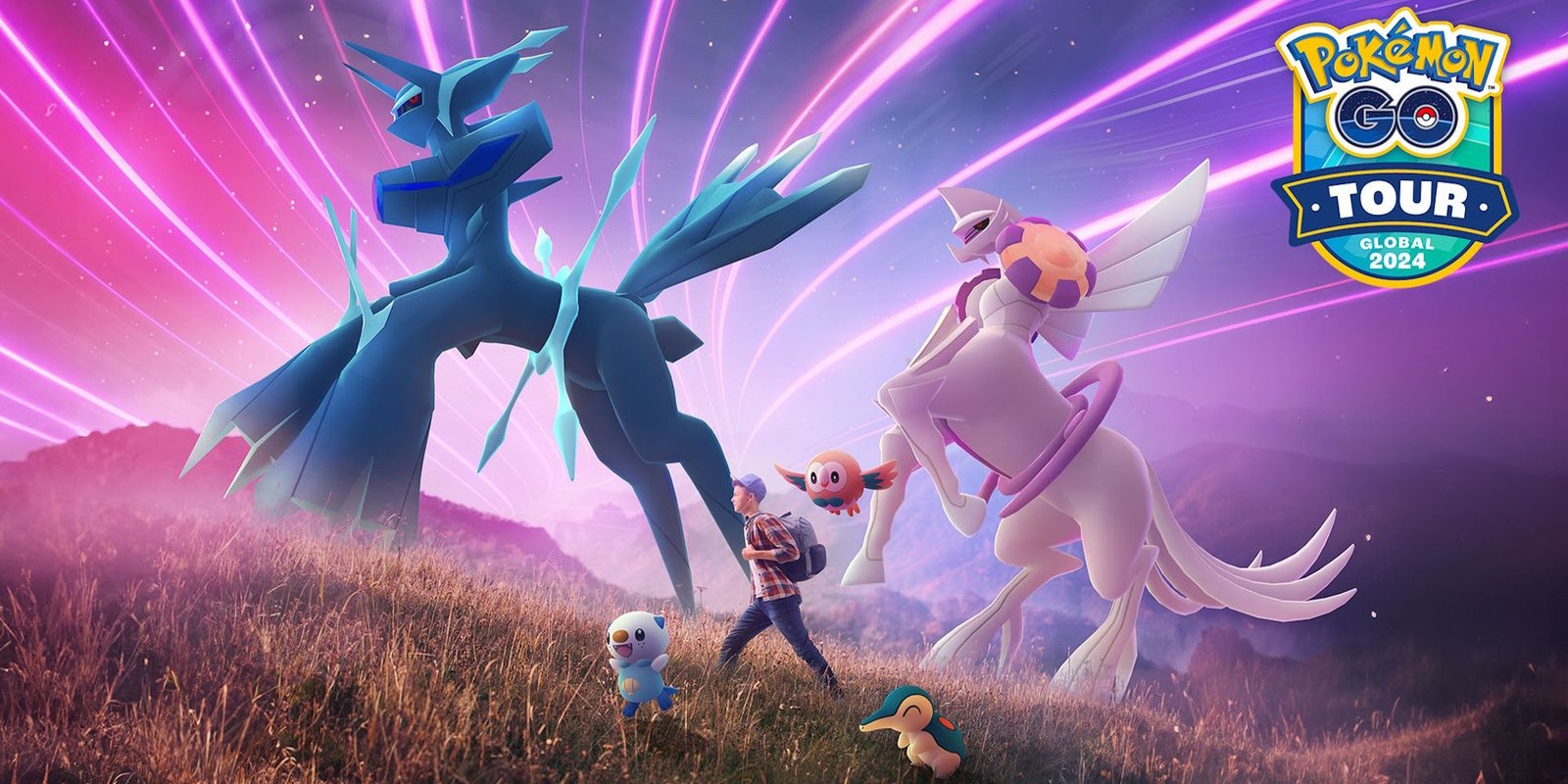 A Pokemon trainer walks with Origin Forme Dialga and Palkia, Rowlet, Cyndaquil, and Oshawott in Pokemon GO.