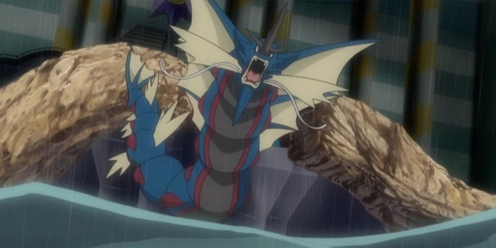 Mega Gyarados rises out of the water in the Sun & Moon Pokemon Anime.
