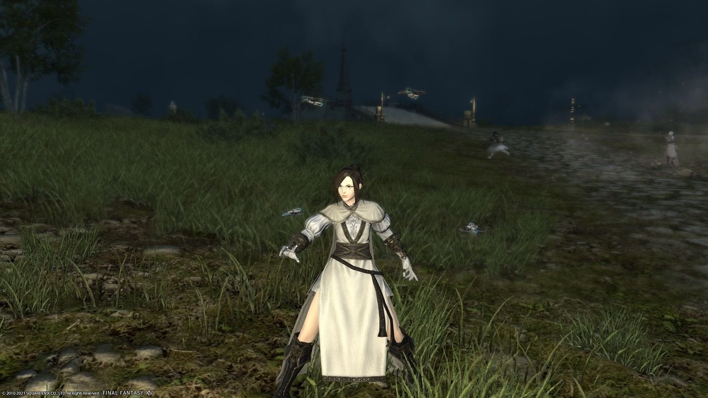 FF14 Sage wearing white robes and holding out hand to cast spell in a grassy field at night