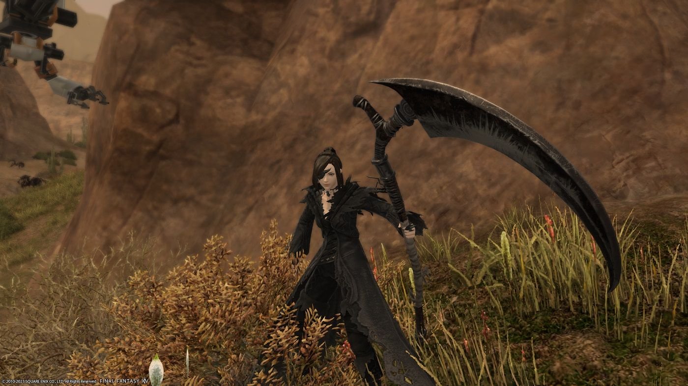 FF14 Reaper job holding a giant scythe in front of a hill