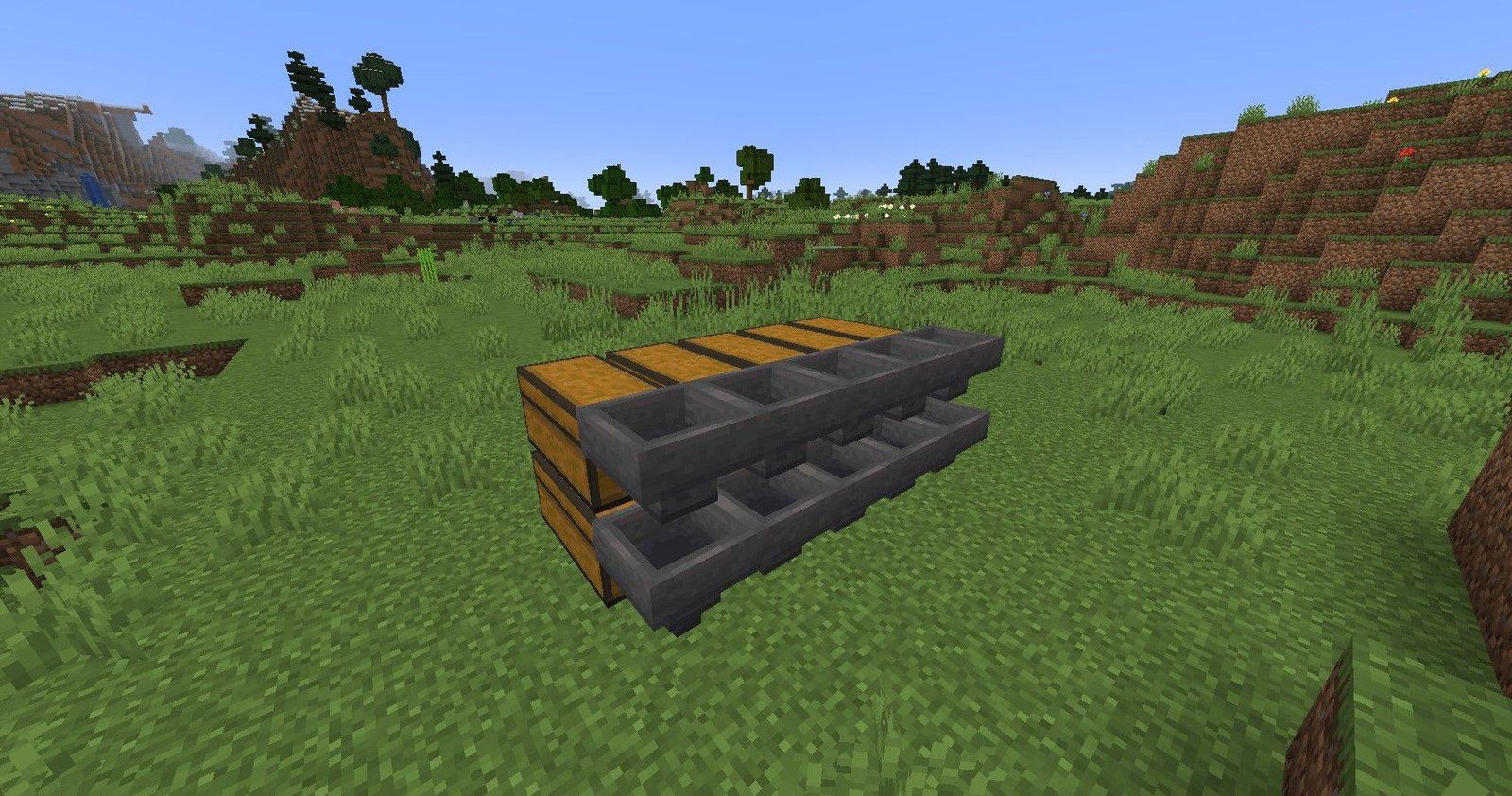 The first step in making Minecraft auto-sorter, with chests and hoppers placed. 