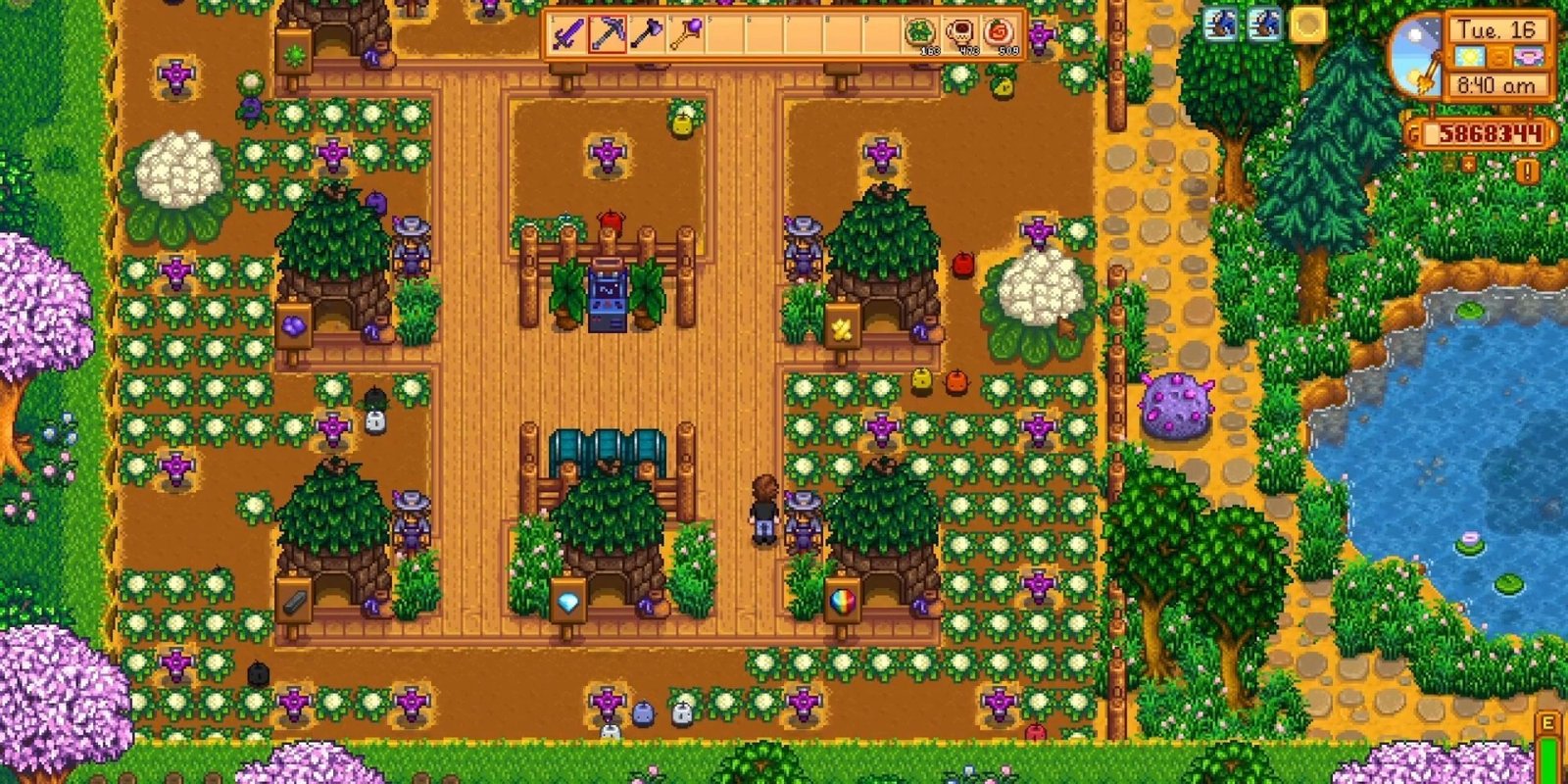 junimo huts in stardew valley with several cauliflower plants