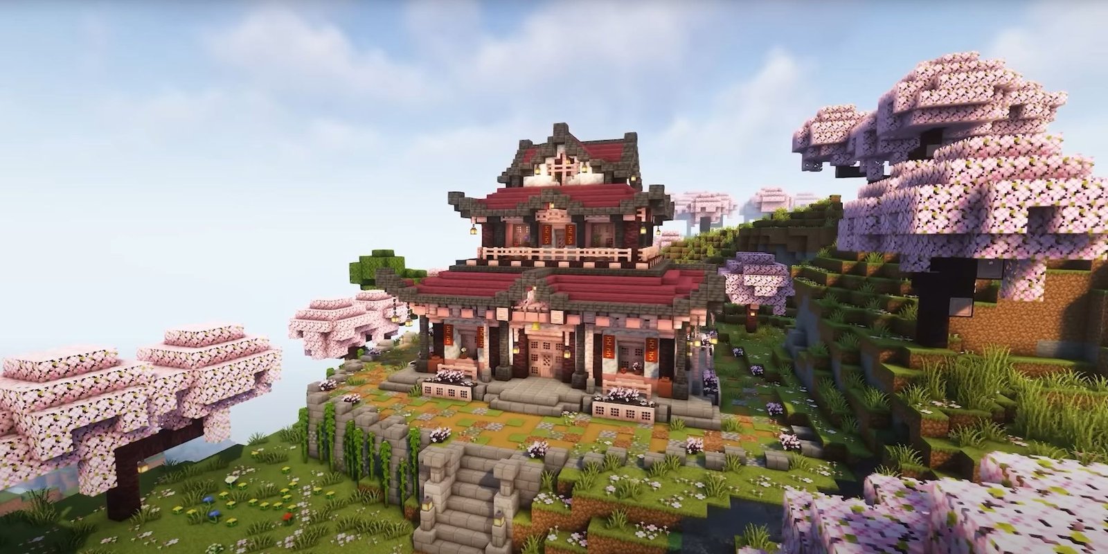 An image from Minecraft of a Japanese inspired Cherry House. This structure is made using the new types of wood added to the game, and is modeled after a Japanese temple. 