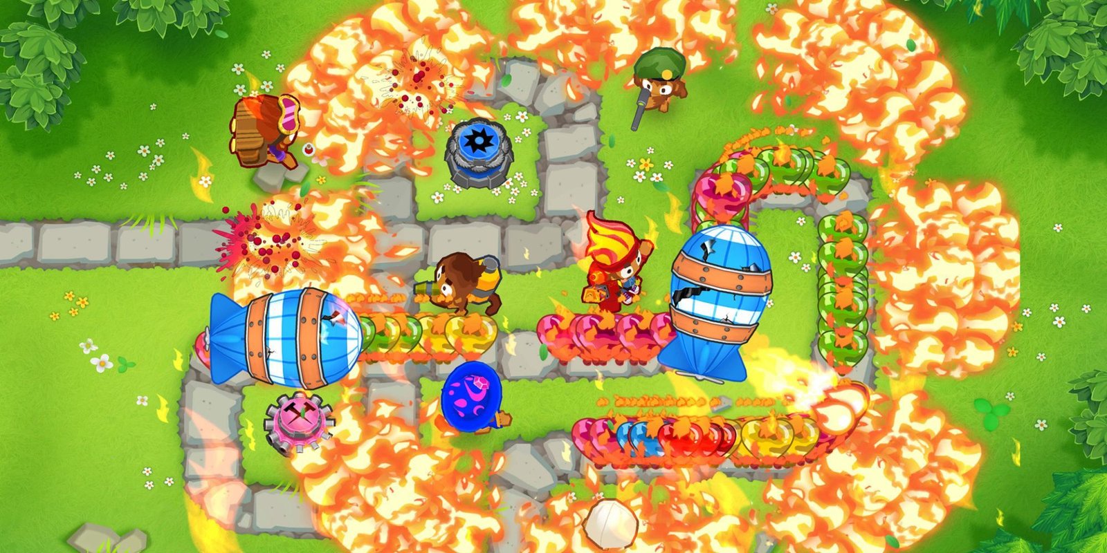 Flames spew in every direction, burning green, yellow, blue, and red balloons.