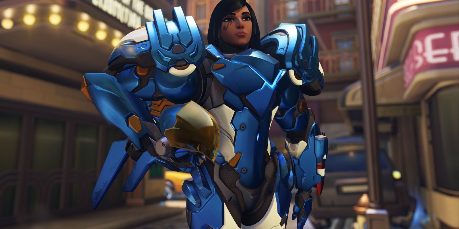 Pharah in Overwatch 2 standing to attention with her helmet under her arm.