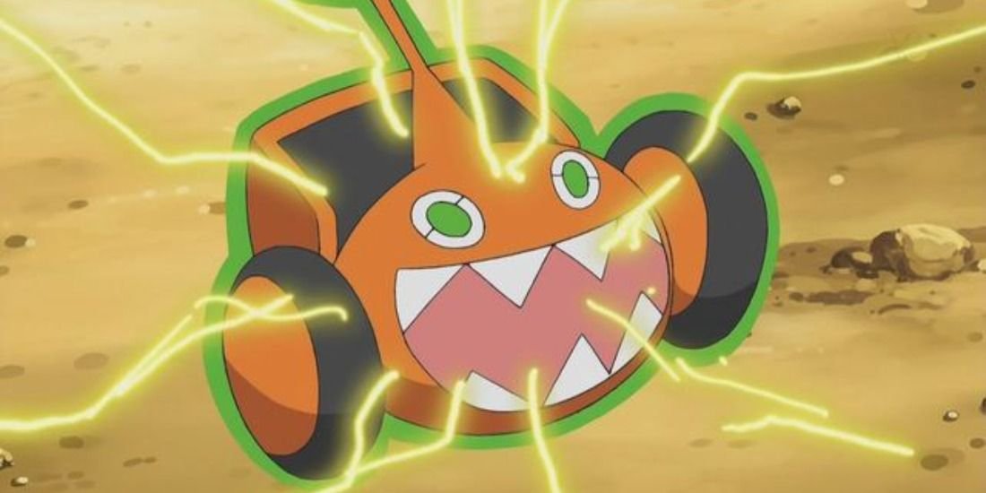 Row Motom, or Rotom-M, surging electricity while posessing a Lawn Mower in the Pokemon anime.