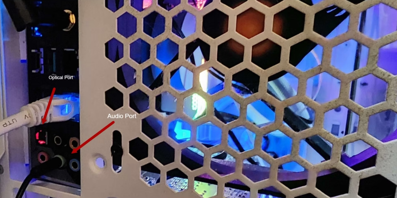 A picture of the back of a PC showing the Optical and Audio ports.